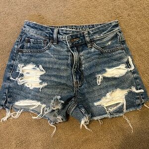 Size 0 American Eagle blue Asymmetrical Jean Shorts. Brand New, never worn.